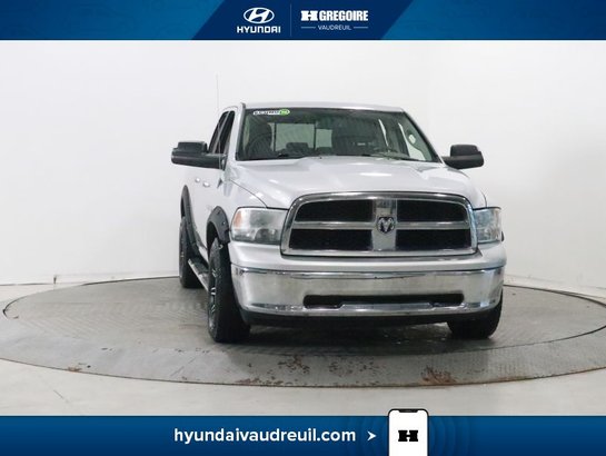 2012 Dodge Ram 4WD Quad Cab 140.5" SLT Silver
