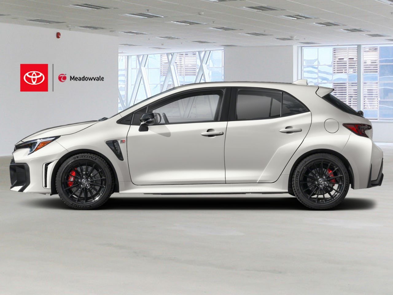 2026 Toyota GR Corolla Premium Package Adds upgrades like a forged carbon-fiber roof, a prominent hood bulge with functional vents, a sub-radiator for enhanced track cooling, and a head-up display White Mississauga - photo #2
